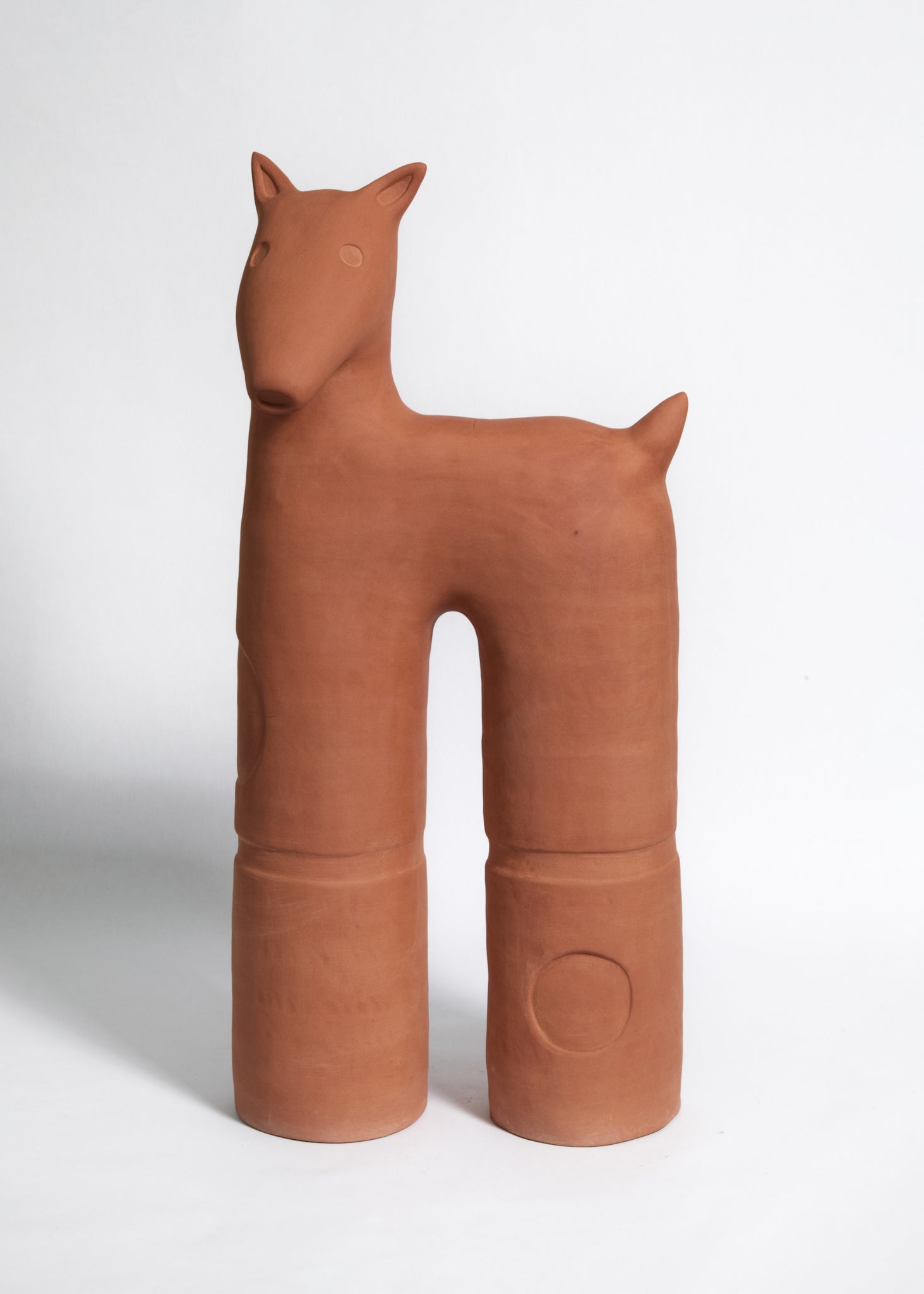 Ceramic dog figurine on a white background